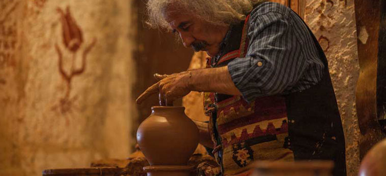 Decorative photo. Man making pottery.